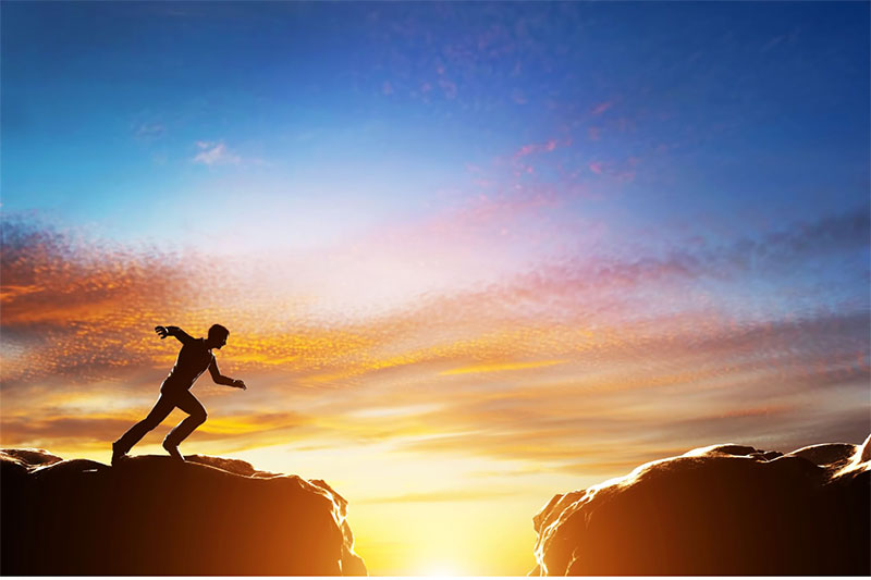 Man-jumping-a-divide